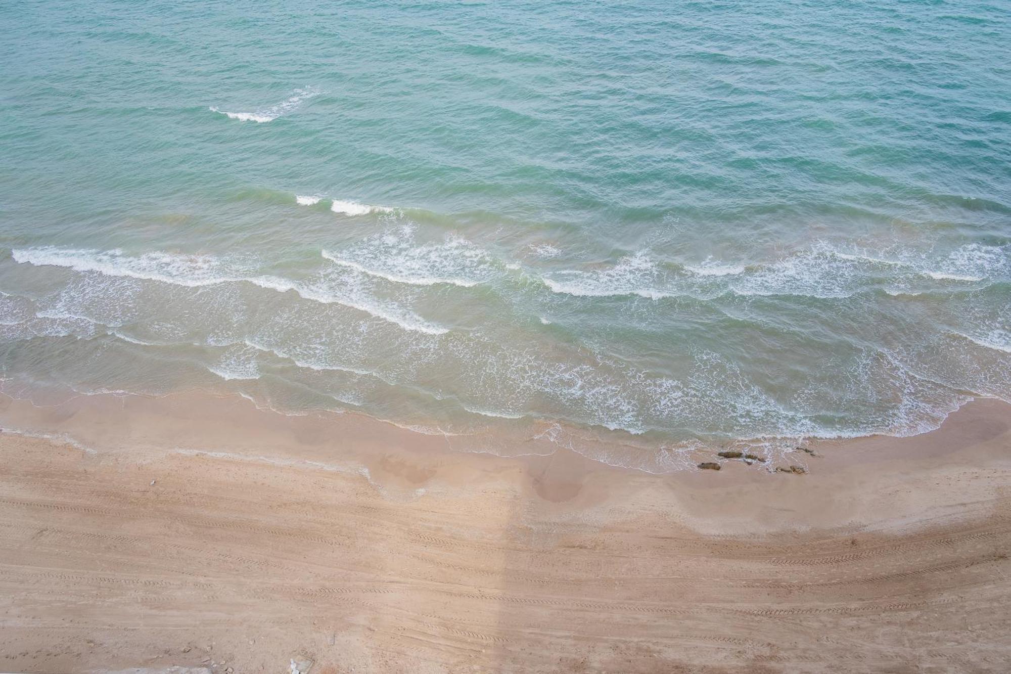 Ocean's Whisper: Les Palmeres Seaview Sanctuary Apartment
